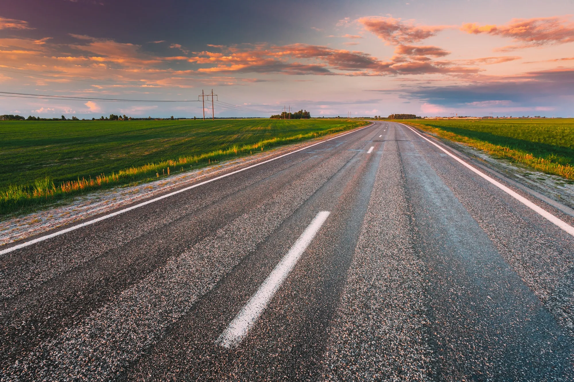 Open highway at sunset